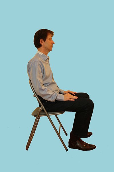 sophrology session in a seated relaxation position